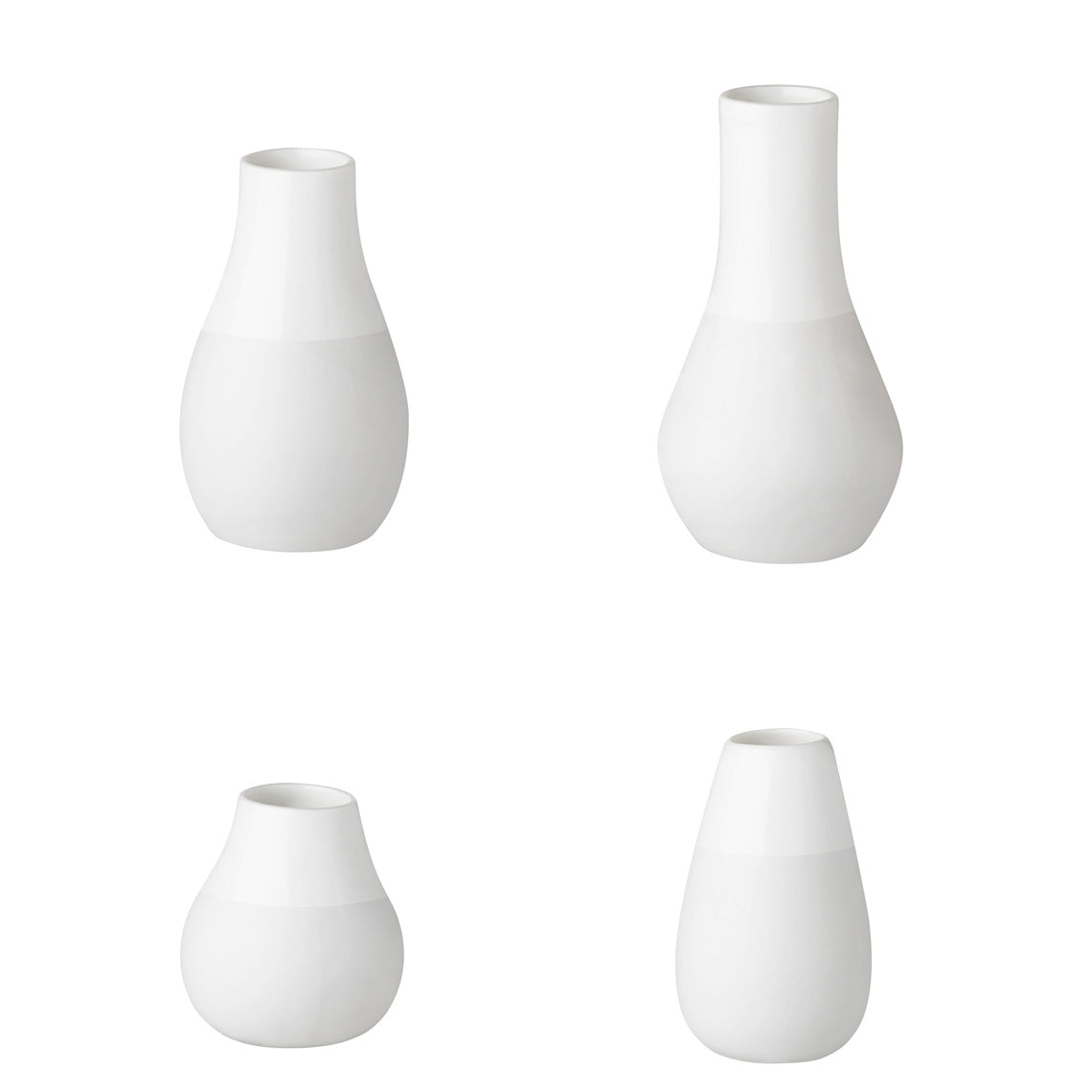 Set of 4 Mini White Vases - Four small vases for single stems such as forget-me-not and eucalyptus . These small porcelain vases were handmade.  4 vases in a gift box  size - 4 - 8.5cm colour - white material - porcelain brand - Rader